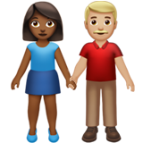 👩🏾‍🤝‍👨🏼 Woman and Man Holding Hands: Medium-Dark Skin Tone, Medium-Light Skin Tone, Emoji by Apple