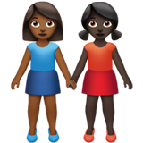 👩🏾‍🤝‍👩🏿 Händchen Haltende Frauen: Mitteldunkle Hautfarbe, Dunkle Hautfarbe Emoji von Apple