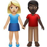 👩🏼‍🤝‍👨🏿 Woman and Man Holding Hands: Medium-Light Skin Tone, Dark Skin Tone, Emoji by Apple