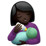👩🏿‍🍼 Woman Feeding Baby: Dark Skin Tone, Emoji by Apple
