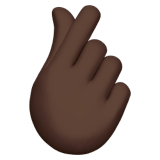 🫰🏿 Hand with Index Finger and Thumb Crossed: Dark Skin Tone, Emoji by Apple