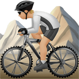 🚵🏼 Person Mountain Biking: Medium-Light Skin Tone, Emoji by Apple