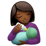 👩🏾‍🍼 Woman Feeding Baby: Medium-Dark Skin Tone, Emoji by Apple