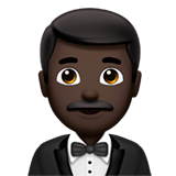 🤵🏿‍♂️ Man in Tuxedo: Dark Skin Tone, Emoji by Apple
