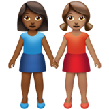 👩🏾‍🤝‍👩🏽 Women Holding Hands: Medium-Dark Skin Tone, Medium Skin Tone, Emoji by Apple