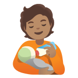 🧑🏽‍🍼 Personne Allaitant Un Bébé : Peau Légèrement Mate Emoji par Google