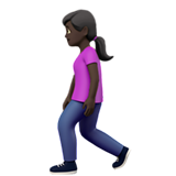 🚶🏿‍♀️ Woman Walking: Dark Skin Tone, Emoji by Apple