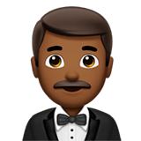 🤵🏾‍♂️ Man in Tuxedo: Medium-Dark Skin Tone, Emoji by Apple